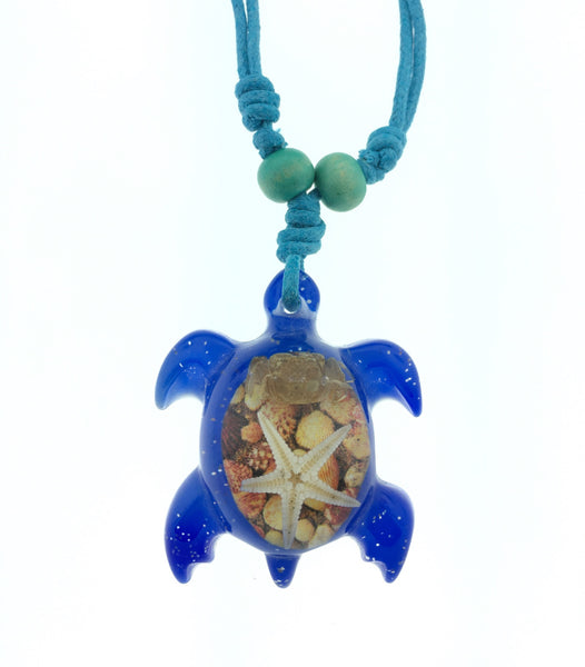Blue or pink resin turtle necklace with starfish and crab.